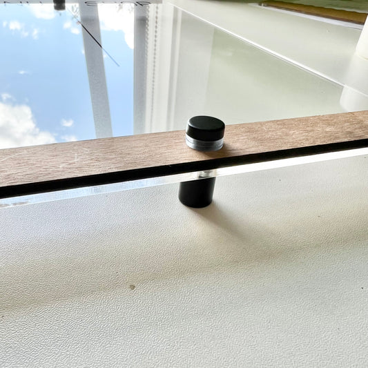 Acryluxe Supply Co standoffs, clear metal mounting hardware with screws, used for secure panel or glass mounting.